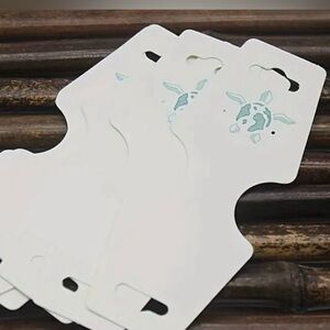 70 White Jewelry Display Cards with Teal Turtle Accent - Set 70
